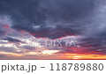 The Sun Setting over the Horizon and Feathery Colorful Clouds Fast Lapse Time.  118789880