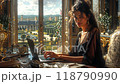 Woman working on a laptop near a window with a beautiful sunny view 118790990