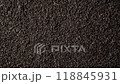 Background of black fanning or broken loose leaf tea slowly rotating. Close up, top view 118845931