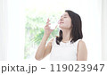 A woman drinking water 119023947