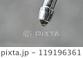 extreme close up dripping water from faucet. leaking tap. waste water. drops of water dripping from tap. leaky valve. save water concept. save budget 119196361