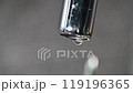 Drop of water drips from the tap. Beautiful fresh and clean water flowing Close-up front view broken chrome faucet in kitchen. Everyday problems, wasting water and energy 119196365