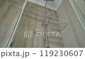Modern shower enclosure with glass shelves and sleek fixtures 119230607