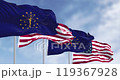 Indiana state flags waving with the national flag of the United states on a clear day. Seamless 3d render animation. Slow motion loop. Selective focus 119367928