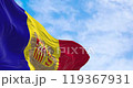 Flag of the Principality of Andorra waving in the wind on a clear day. Vertical blue-yellow-red stripes with coat of arms in center. Seamless 3d render animation. Slow motion loop. Selective focus 119367931