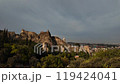 Ancient fortress ruins overlooking a serene valley in Georgia at dusk 119424041