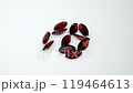 Radiant Collection of Shimmering Red Gems on Clean White Surface 119464613