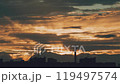 Rain clouds at sunset over the city 119497574