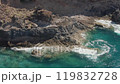 View of ocean water slowly pouring over volcanic ocean shores. Rocks near Canical on Madeira Island, Portugal 119832728