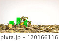 Green graph bars rise from the pile of gold coins, Business concept 120166116