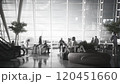 People in boarding lounge in airport terminal. People waiting for their flight at the airport. 120451660
