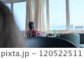 Passengers Relaxing in Ferry Lounge Serene Travel Atmosphere 120522511