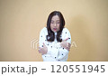 Stylish Model Showing Seasonal Discomfort and Shivering in Contemporary Casual Outfit Captured in Minimal Studio Setting Ideal for Lifestyle Content 120551945