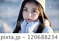 A beautiful girl is gazing at the snow 120688234