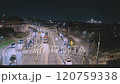 A mesmerizing timelapse of a bustling city street at night. The video captures the flow of traffic, the movement of pedestrians, and the city lights creating a dynamic urban scene.  120759338
