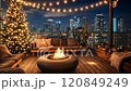 Christmas cozy terrace atmosphere on a rooftop with fire pit and city lights illuminating the night 120849249