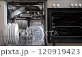 The woman closed the dishwasher and started washing the dishes .Slow motion video 120919423