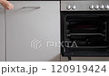 The woman opened the dishwasher after the dishes had been cleaned. Slow motion video 120919424