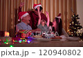 Happy cheerful Asian family is celebrating Christmas and New Year dinner party together, a family with mother, father and son. Asian lovely family celebrate Christmas - New Year festival. 120940802