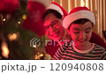 Happy cheerful Asian family celebrating Christmas and New Year dinner party together, a family with father and son. Asian lovely family celebrate Christmas - New Year festival. 120940808