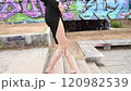 slow motion of a woman legs wearing black dress side view  120982539