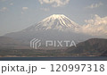 Mount Fuji towering over the foothills and lake, timelapse, fixed shot 120997318