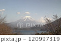Mount Fuji towering over the foothills and lake, timelapse, fixed shot 120997319