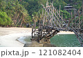 A Rustic Bamboo Bridge Gracefully Arching Over Crystal Clear Waters in a Serene Setting. Haad Sadet Beach, Koh Phangan island, Thailand 121082404