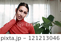 Young hispanic woman struggling with neck and backache and discomfort close up 121213046