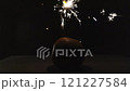 Lighting a Festive Sparkler: Orange and Holiday Magic. Stock Footage Video 121227584