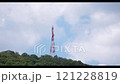 Time lapse Directional antenna array on a red and white communication tower against sky. 121228819