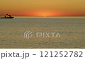 The Serene and Captivating Sunset Glowing Over Tranquil Waters and Soft Gentle Waves 121252782