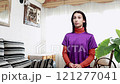 Young woman stretching arms in slow motion. Generation z hispanic woman 121277041