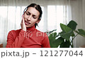 Young hispanic woman experiencing intense toothache or tooth pain 121277044