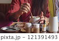 Meditative Ritual of Mixing Natural Ingredients for Incense Ceremony 121391493