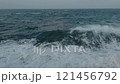 Storm at sea. Splashes from bow of vessel. White foam on wind. Side view from ship. 121456792