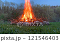 Bonfire surrounded by stones 121546403