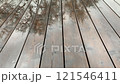 Rain dripping on a wooden terrace 121546411