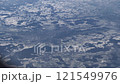 Top bird eye View from passenger porthole of beautiful landscape Flying airplane engine wing of plane fly on sunny cloudy day in winter. Transport, tourism, travel, flight, holidays vacation concept. 121549976