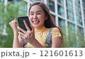 Asian women overjoyed and excited celebrating good news watching smartphones to win the prize and lottery, Young entrepreneurs celebrate business triumphs success, online lifestyle, and social media 121601613