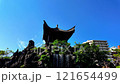 The forest management and the pavilion at Fukushu-en Garden against the backdrop of a clear blue sky (HD footage) 121654499