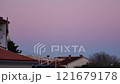 Beautiful color transitions in the sky at dusk after sunset. Natural beauty in nature. Landscape with roofs of city houses. Natural gradient background. Pula, Croatia - January 3, 2025 121679178