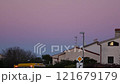 Beautiful color transitions in the sky at dusk after sunset. Natural beauty in nature. Landscape with roofs of city houses. Natural gradient background. Pula, Croatia - January 3, 2025 121679179