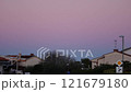 Beautiful color transitions in the sky at dusk after sunset. Natural beauty in nature. Landscape with roofs of city houses. Natural gradient background. Pula, Croatia - January 3, 2025 121679180