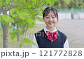 A Japanese junior high school girl smiling under a tree 121772828