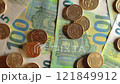20 Euro Cent Coins on the 100 Euro Banknotes - Top View 121849912