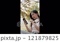 Cute girl enjoying a relaxing time in the park. 121879825