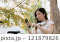 Cute girl enjoying a relaxing time in the park. 121879826