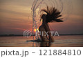 Elegant Hair Flip with Sunset Arc 121884810