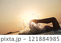 Leg Splashing Against the Golden Sunset 121884985